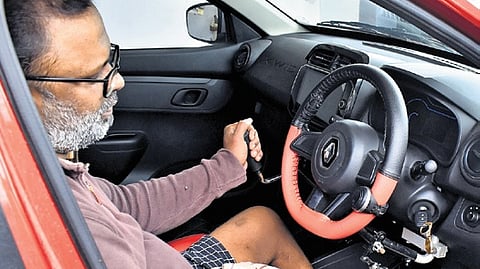 K Robin Benifer in the car which has been modified