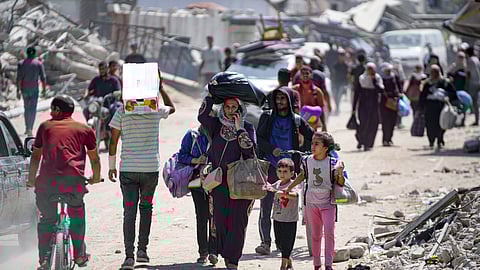 Palestinians displaced by the Israeli air and ground offensive on the Gaza Strip flee from parts of Khan Younis following an evacuation order by the Israeli army to leave the eastern part of Gaza Strip's second largest city.