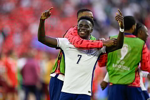 England's forward #07 Bukayo Saka celebrates after winning the UEFA Euro 2024 quarter-final football match between England and Switzerland at the Duesseldorf Arena in Duesseldorf on July 6, 2024.