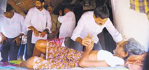 Revenue Minister Ponguleti Srinivasa Reddy interacts with a victim in Aswaraopet mandal  on Monday