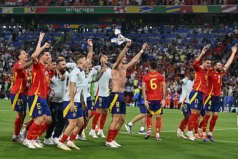Spain's players celebrate at the end of the UEFA Euro 2024 semi-final football match between Spain and France at the Munich Football Arena in Munich on July 9, 2024. 