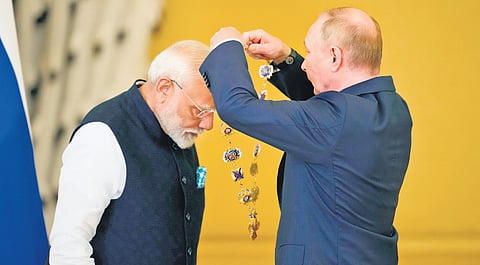 Russian President Vladimir Putin confers the award of the ‘Order of St Andrew the Apostle’ on visiting Prime Minister Narendra Modi, at the Kremlin in Moscow on Tuesday | AP/PTI