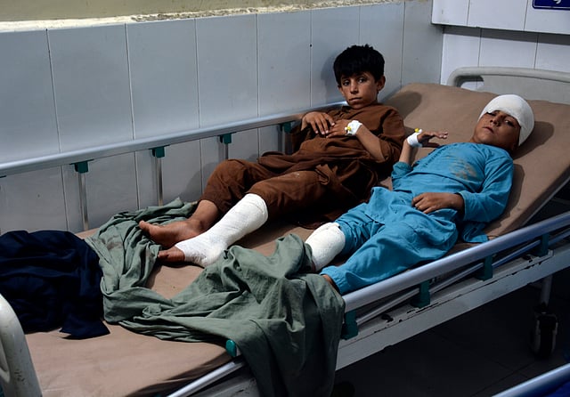 Injured victims of a rain storm are treated at a hospital, in the city of Jalalabad, Nangarhar province east of Kabul, Afghanistan.