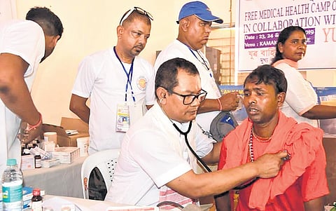 Numal Momin consulting a patient