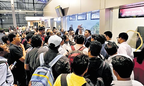 Due to the Microsoft outage on Friday, passengers wait near the IndiGo counter at Rajiv Gandhi International Airport.