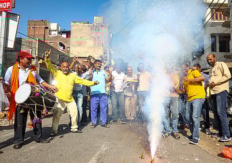Congress workers celebrate after party's victory in Uttarakhand Assembly by-elections, in Jammu, Saturday, July 13, 2024.