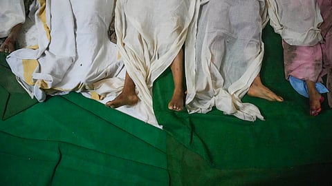 Bodies of victims of the Hathras stampede lie at Bagla District Hospital in Hathras