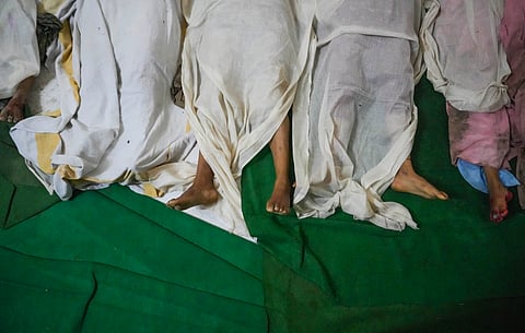 Bodies of victims of the Hathras stampede lie at Bagla District Hospital in Hathras