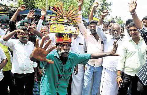DMK partymen celebrate in Vikravandi after the party candidate Anniyur Siva, secured an unattainable lead on Saturday