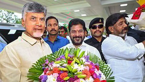  Telangana Chief Minister Revanth Reddy welcomes Andhra Pradesh Chief Minister N Chandrababu Naidu upon his arrival at Praja Bhavan, in Hyderabad. 