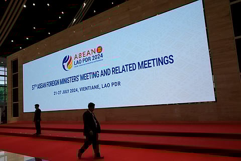 An officer walks in front of a display for the meetings of the Association of Southeast Asian Nations (ASEAN) at the national convention center in Vientiane, Laos, Wednesday, July 24, 2024.