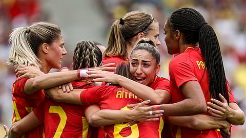 Spain's midfielder #06 Aitana Bonmati celebrates with teammates after scoring her team's first goal in the women's group C football match between Spain and Japan during the Paris 2024 Olympic Games at La Beaujoire Stadium in Nantes on July 25, 2024.