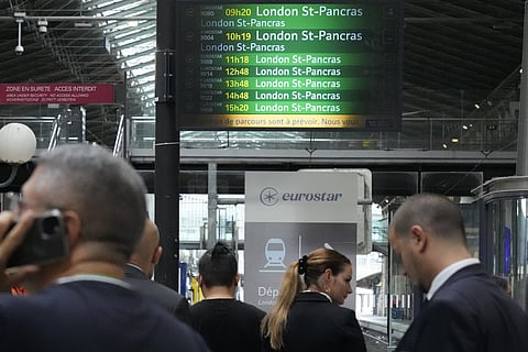 Travelers wait at the Eurostar platform inside the Gare du Nord train station at the 2024 Summer Olympics, Friday, July 26, 2024