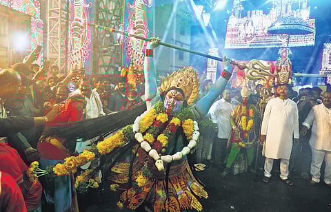 Devotees dressed like Hindu deities were seen performing during a Bonalu procession in  Old City on Sunday 