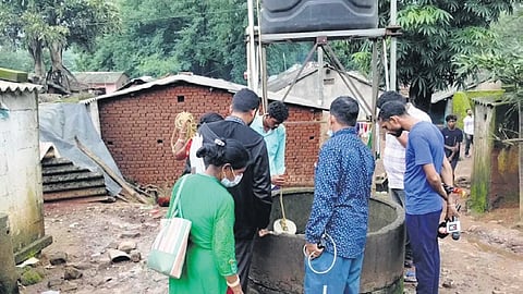The health team inspecting a borewell in the village on Monday 