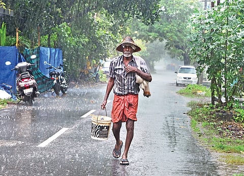 A fisherman returns home after work amid heavy rain on Wednesday. Image used for representational purposes.