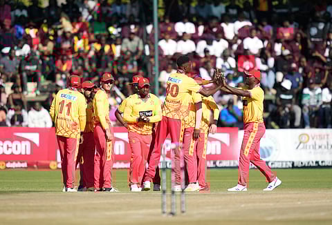 Zimbabwe players celebrate after winning against India in the first match of the T20I series.