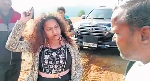 Screengrab of Puja Khedkar’s mother flashing a gun at a farmer.