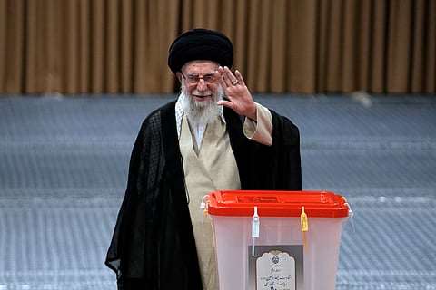 Iranian Supreme Leader Ayatollah Ali Khamenei casts his vote for the presidential runoff election in Tehran, Iran, Friday, July 5, 2024. 