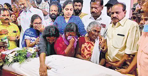 Melhi weeps inconsolably as she sits beside the body of her son Joy at the house of the latter’s brother at Marayamuttom in Thiruvananthapuram on Monday. Mayor Arya Rajendran is also seen