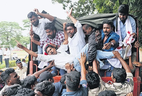 Members of various student unions stage a protest against alleged irregularities in conduct of NEET exams, in Hyderabad on Monday.