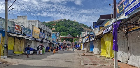 Several hundreds of shops were closed in Palani town and Palani Adivaram to protest against the fencing of Girivala path in Palani hill on Saturday.