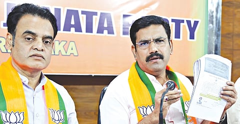 BJP state president BY Vijayendra addresses a press meet, as MLA Dr CN Ashwath Narayan looks on, at Jagannath Bhavan in Bengaluru on Wednesday.