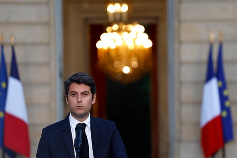 Macron asks French prime minister to stay on for the sake of stability