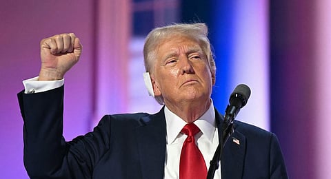 US former President and 2024 Republican presidential candidate Donald Trump raises his fist as he speaks aon the last day of the 2024 Republican National Convention at the Fiserv Forum in Milwaukee, Wisconsin, on July 18, 2024. 