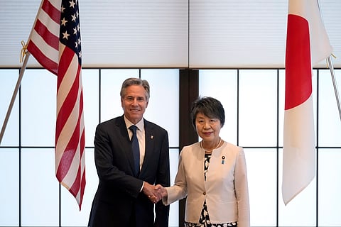 U.S. Secretary of State Antony Blinken, left, and Japanese Foreign Minister Yoko Kamikawa shake hands