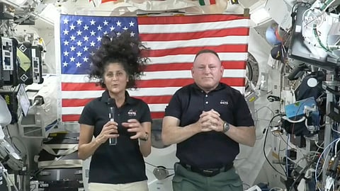 In this image from video provided by NASA, astronauts Suni Williams, left, and Butch Wilmore give a news conference aboard the International Space Station on Wednesday, July 10, 2024. 