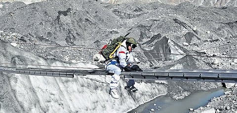 Capt Supreetha CT (inset) crosses a gorge at Siachen Glacier