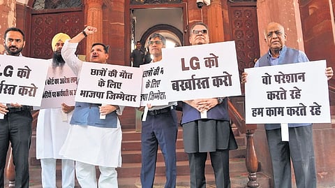 AAP MP Sanjay Singh with other party MPs during a protest in Parliament over drowning of three UPSC aspirants in flooded basement of a coaching centre.