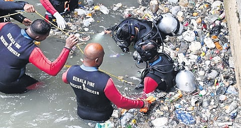 Fire and Rescue Services personnel and a scuba diving team search for the missing person in Amayizhanchan Canal in Thiruvananthapuram 