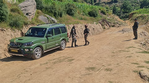 Security personnel during an anti-terror operation after four Army personnel died after being injured in a gunfight with terrorists, in Doda district.