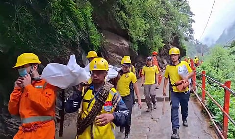  SDRF personnel conduct a rescue operation following a landslide on the Kedarnath trekking route, in Rudraprayag district, Sunday,