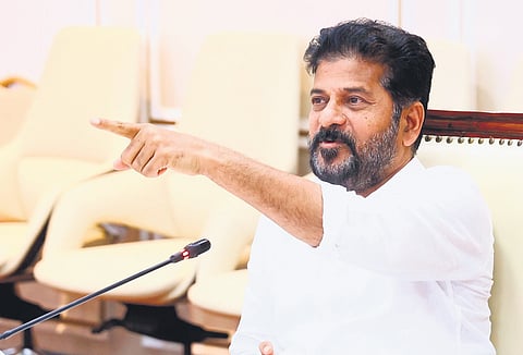 Chief Minister A Revanth Reddy gestures during a review meeting with officials 
of various departments at the Secretariat on Thursday