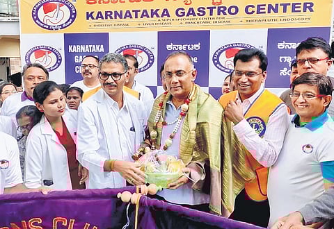 Health Minister Dinesh Gundu Rao flags off the walkathon on World Hepatitis Day in Bengaluru on Sunday 