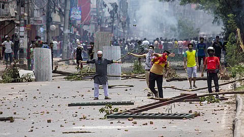 Students clash with police during a protest over the quota system in public service, in Dhaka, Bangladesh.