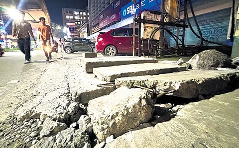 A poorly-maintained footpath at MG Road