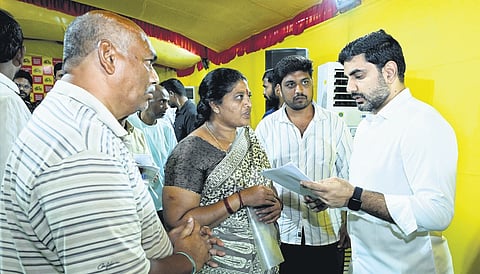 Human Resource Development Minister Nara Lokesh takes representations from people during his Praja Darbar at Undavalli on Friday