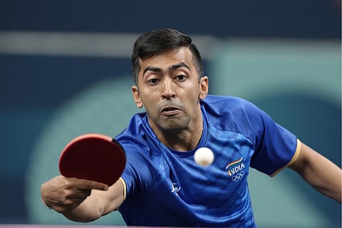 India's Harmeet Desai plays against France's Felix Lebrun during a men's singles round of 64 table tennis game at the 2024 Summer Olympics, Sunday, July 28, 2024