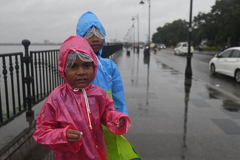 Hyderabad Children were seen wearing raincoats and enjoying the drizzle at Tank Bund in Hyderabad on Saturday. (Representative Image) 