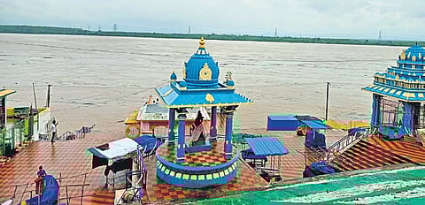 Water overflows on to the bathing ghats near the Sri Sita 
Ramachandraswamy temple in Bhadrachalam on Saturday