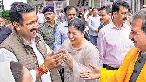 CM Sukhu (R) with wife Kamlesh being greeted by party leader Vikramaditya Singh