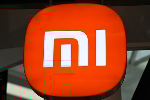 A Xiaomi logo is seen in a store at a shopping mall