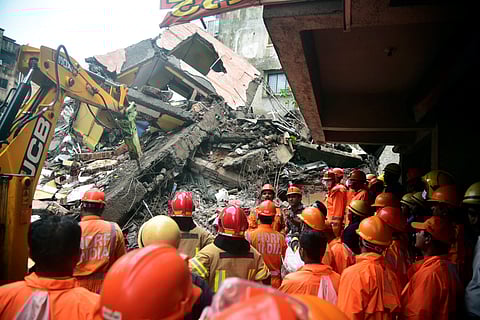 NDRF personnel conduct a rescue operation after a four-storey building collapsed, at Belapur area in Navi Mumbai, Saturday, July 27, 2024.
