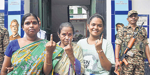 Voters show their ink-marked fingers during Maniktala assembly bypoll in Kolkata