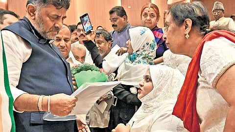 DyCM and KPCC president DK Shivakumar interacts with participants of a Congress meeting at KPCC office in Bengaluru on Saturday   