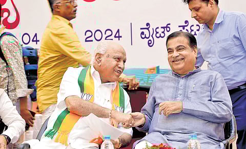 Former CM BS Yediyurappa and Union Minister Nitin Gadkari share a light moment at the BJP state executive committee meeting in Bengaluru on Thursday.